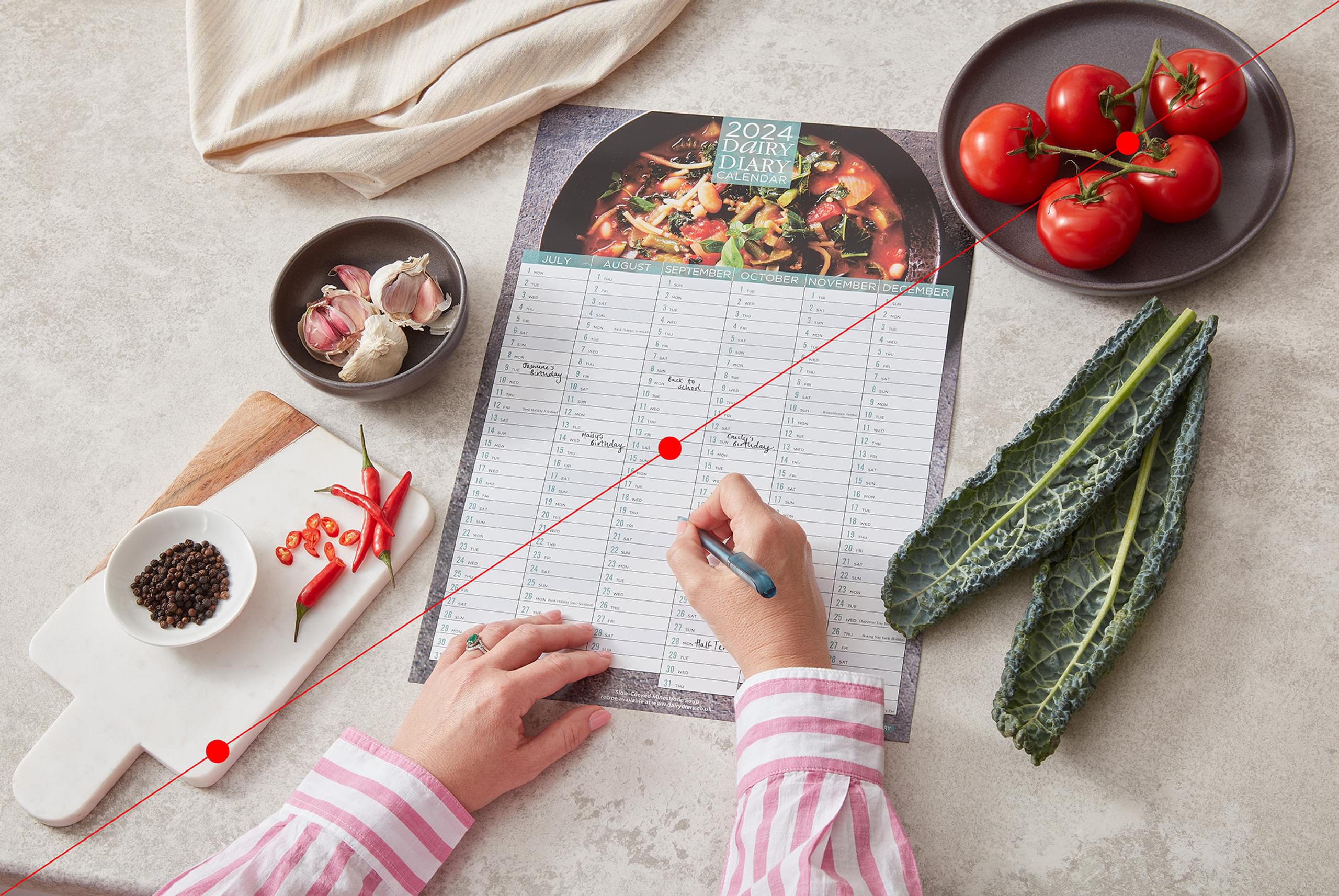 Over shoulder writing on calendar lines